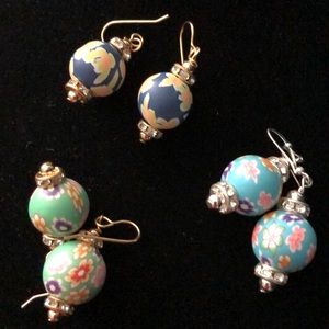 Clay resin earrings in colorful patterns on wires.